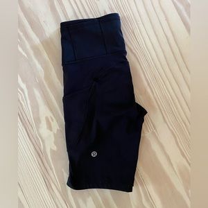 Size 4 Wunder Train shorts with pockets in black. 8” length.